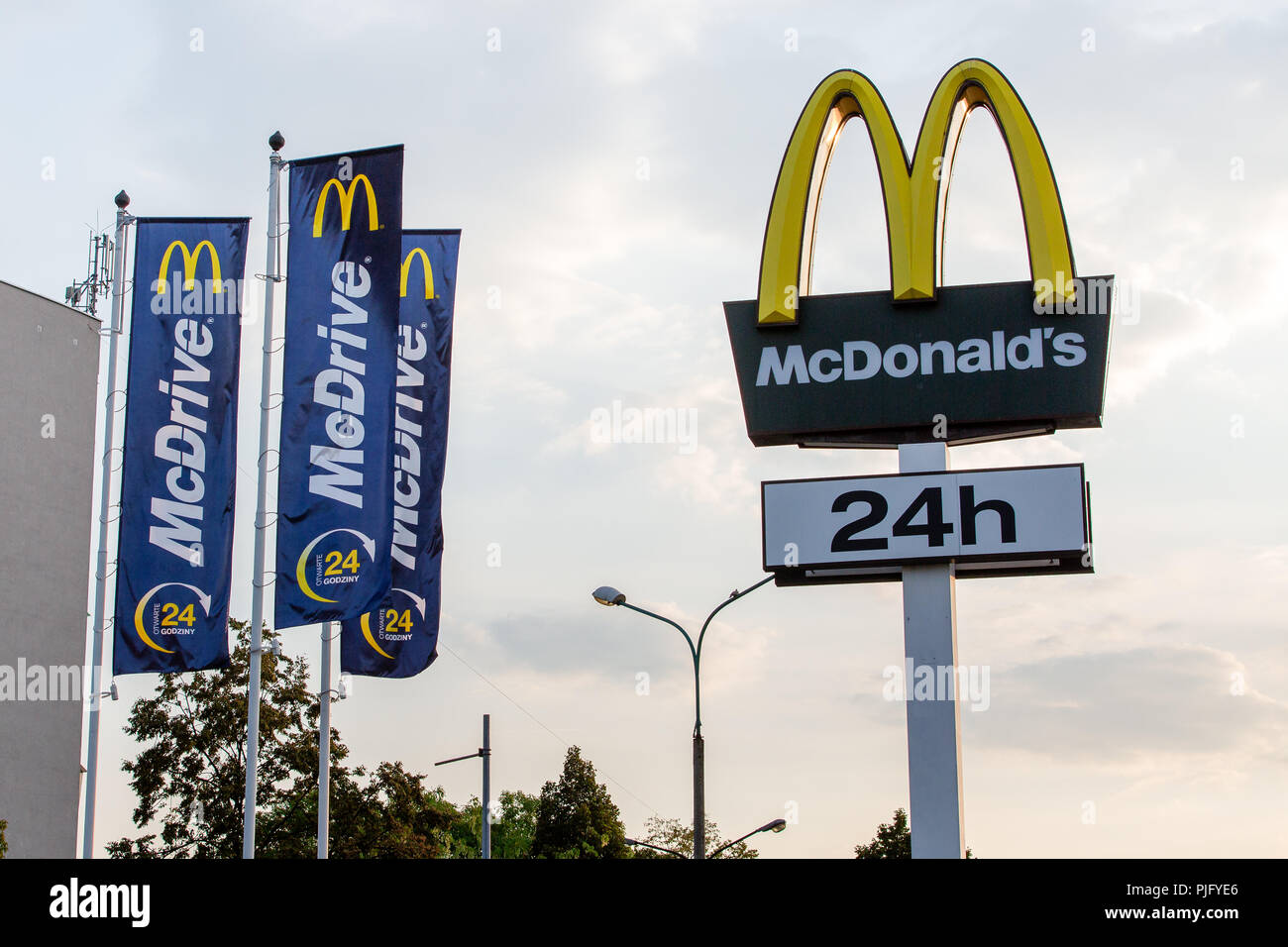 McDonald`s gold arches logo sign global fast food restaurant chain in Tychy, Poland Stock Photo